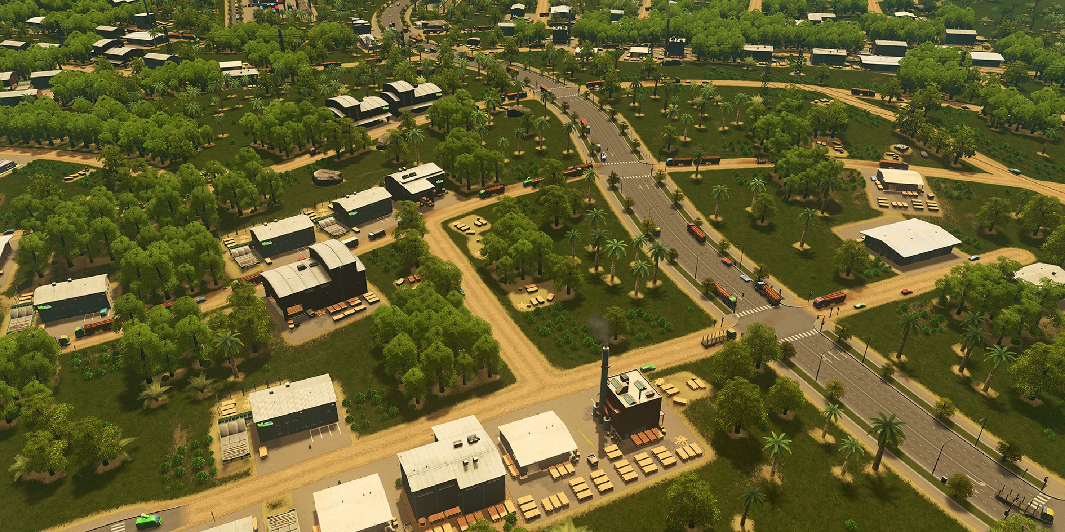 A player in Cities Skylines looking at the industrial zone with trees planted.