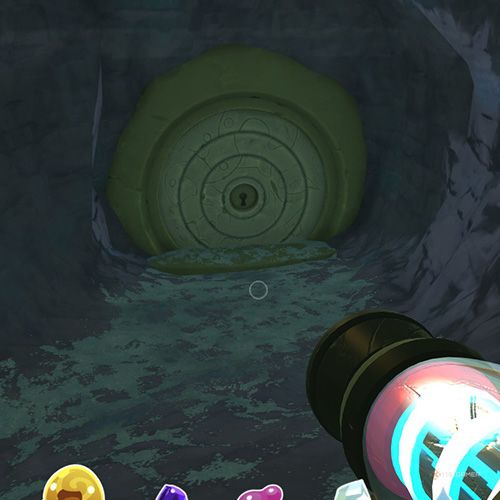 The player is standing in front of the Slime Gate that grants access to Ancient Ruins from the Indigo Quarry in Slime Rancher