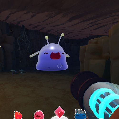 The player is looking at a Phosphor Gordo in one of the Dry Reef's caves in Slime Rancher