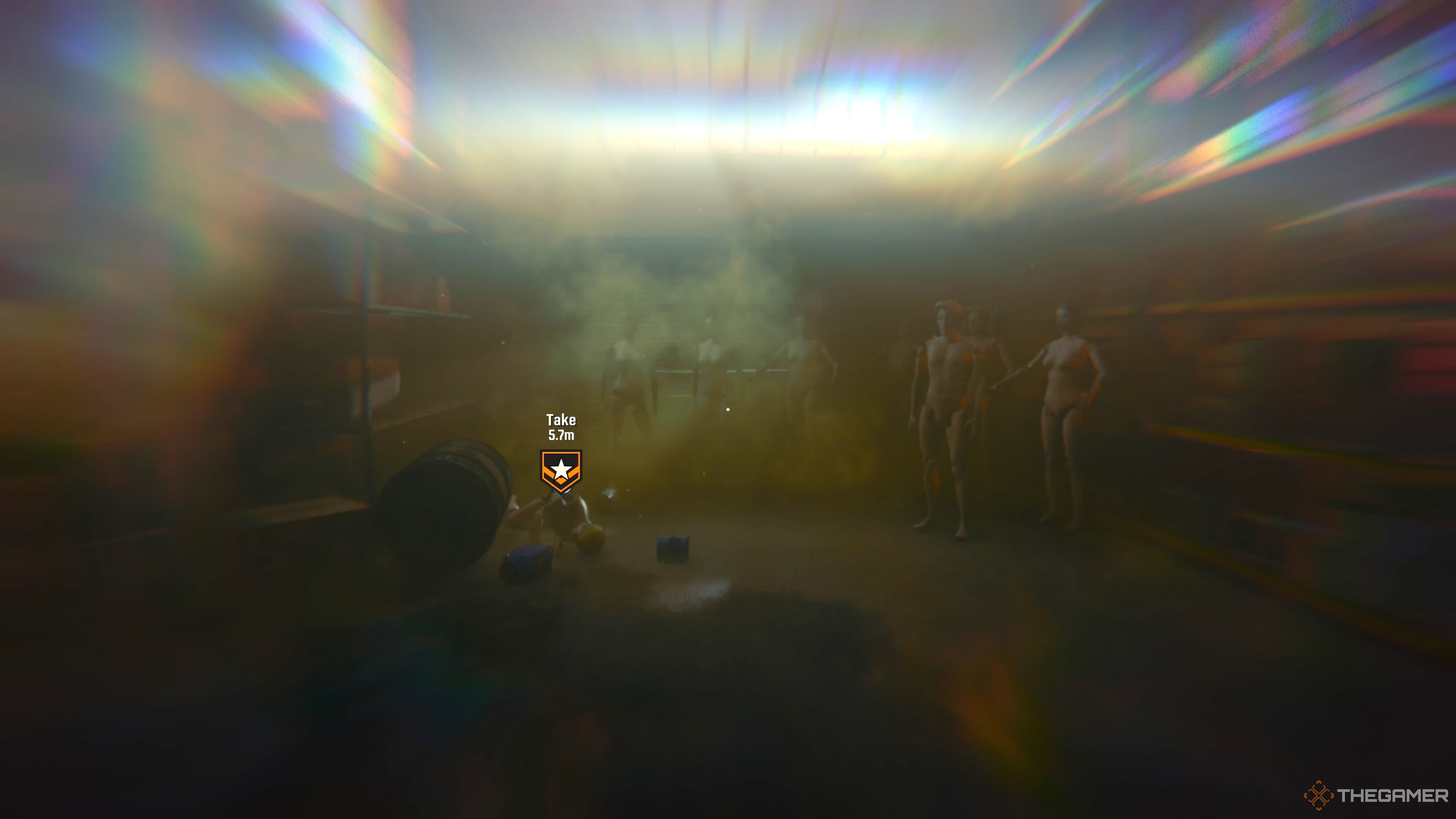 The image contains an objective marker for where a nearby hatchet is attached to a mannequin. The player can go and pick this up, around the area there are several other mannequins and barrels on the floor.