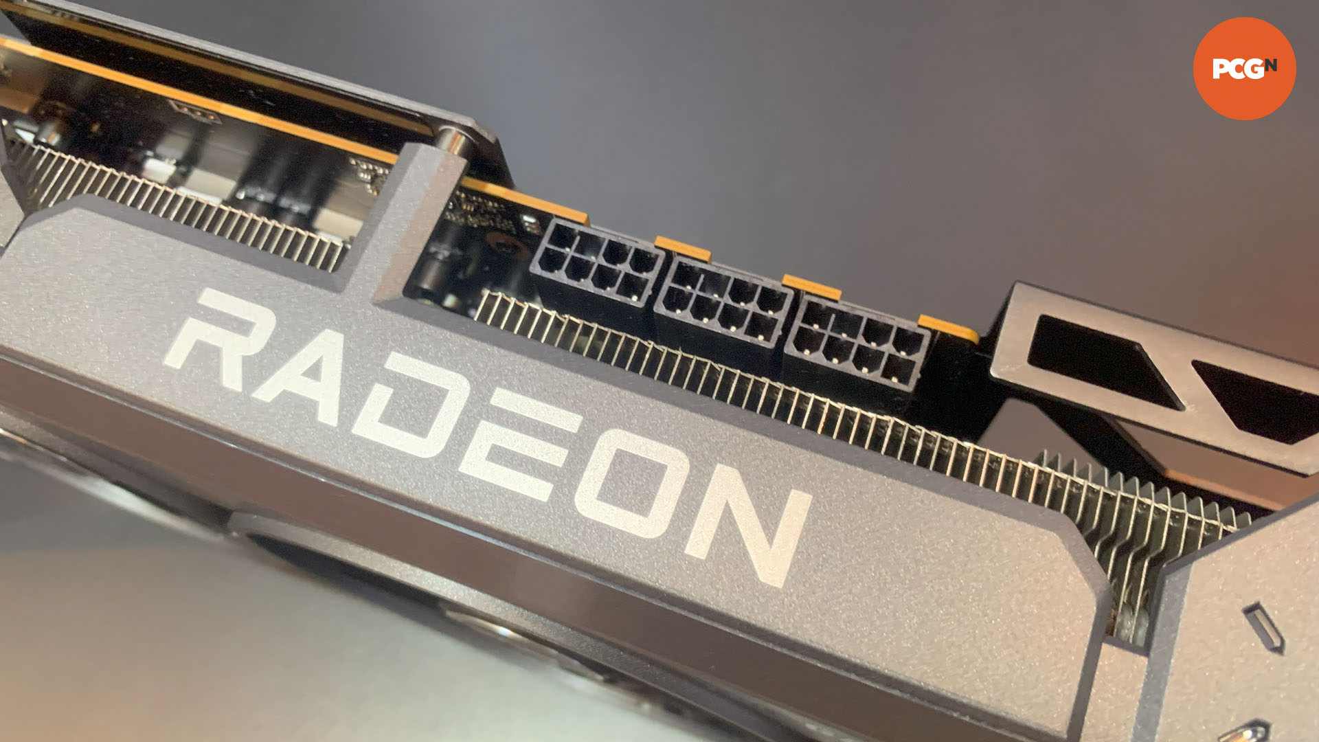 Asus TUF AMD Radeon RX 9070 XT graphics card top edge showing three 8-pin power connectors at CES 2025.