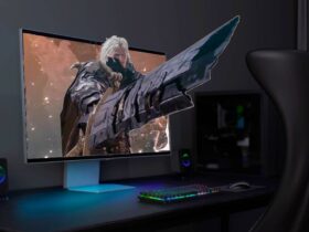 Samsung Odyssey 3D monitor on desk with The First Berzerker: Khazan graphics reaching out of screen