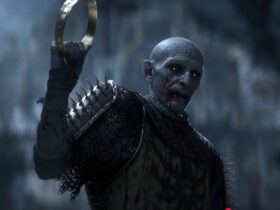 The Blood of Dawnwalker: A screenshot of the vampire Brencis holding up a crown during the trailer for the upcoming game.