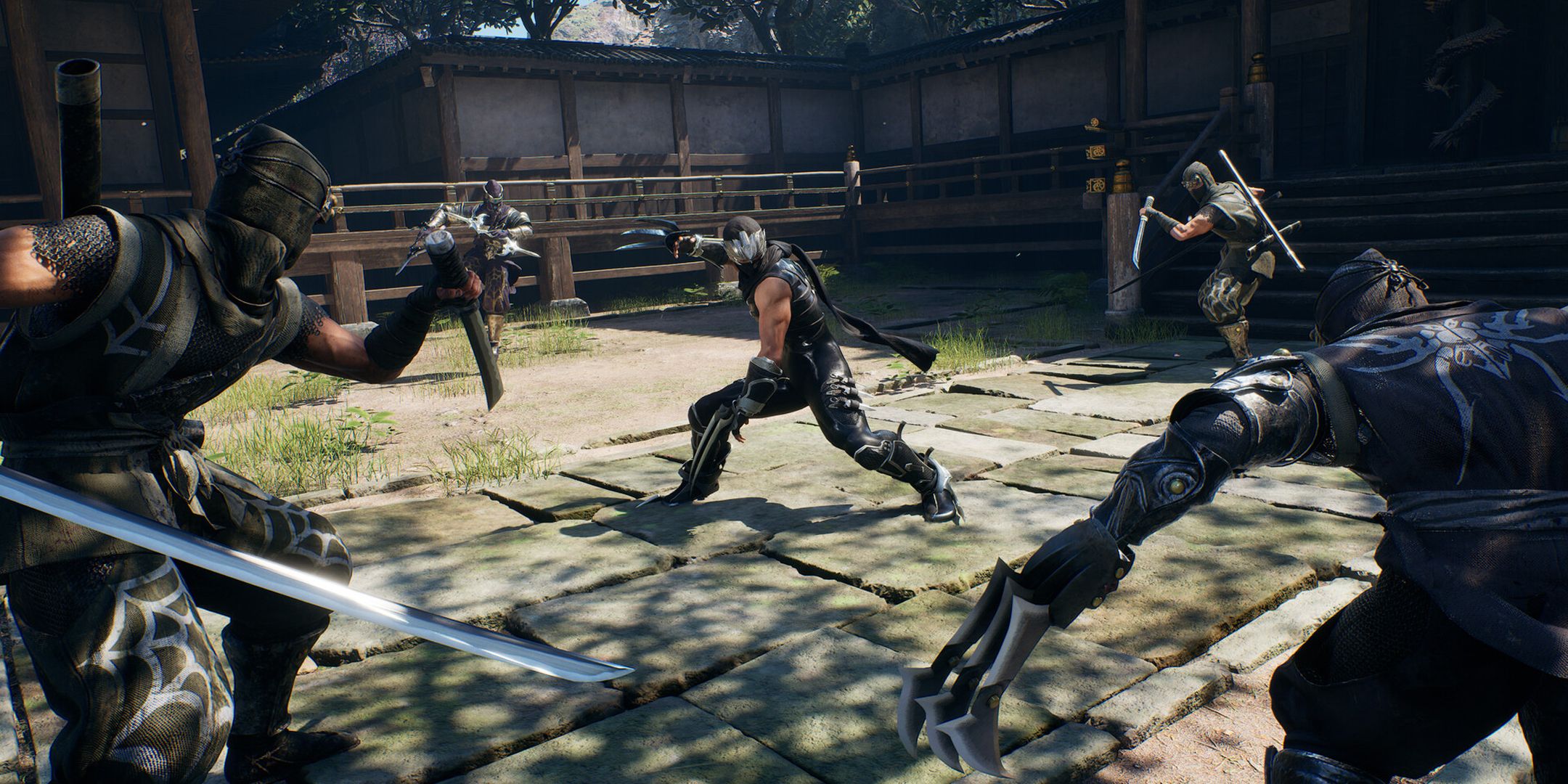 Ninja Gaiden 2 Black screenshot of Ryu surrounded by other ninjas.