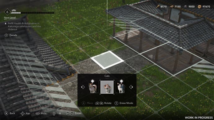 Cats are being placed on a cobblestone path in the building mode of Assassin's Creed Shadows.