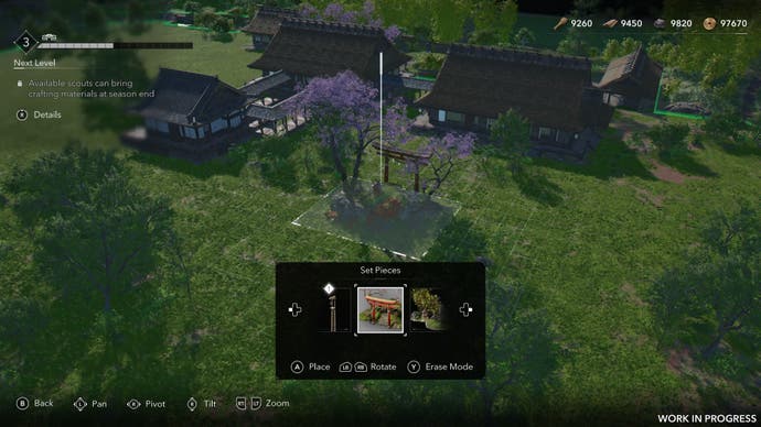 A shinto shrine with sakura trees is being placed on a grassy village plain in Assassin's Creed Shadows.