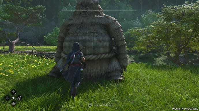 A female shinobi walks up to a large scarecrow in Assassin's Creed Shadows.