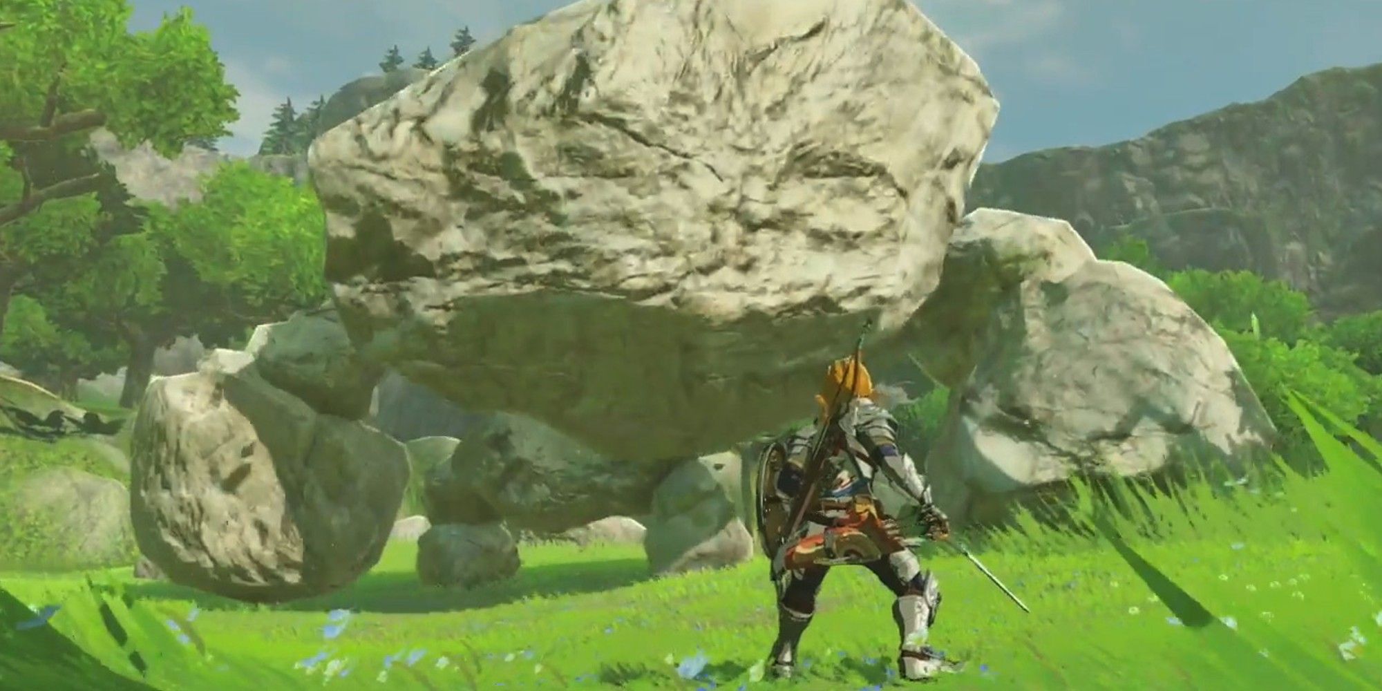 The Legend of Zelda Breath of the Wild screenshot of Link facing off against a Stone Talus.