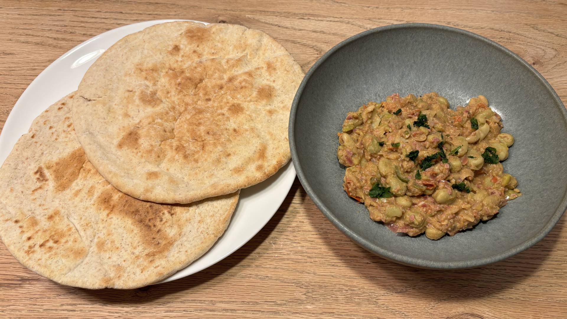 Indiana Jones and the Great Circle ful medames dish with flatbreads