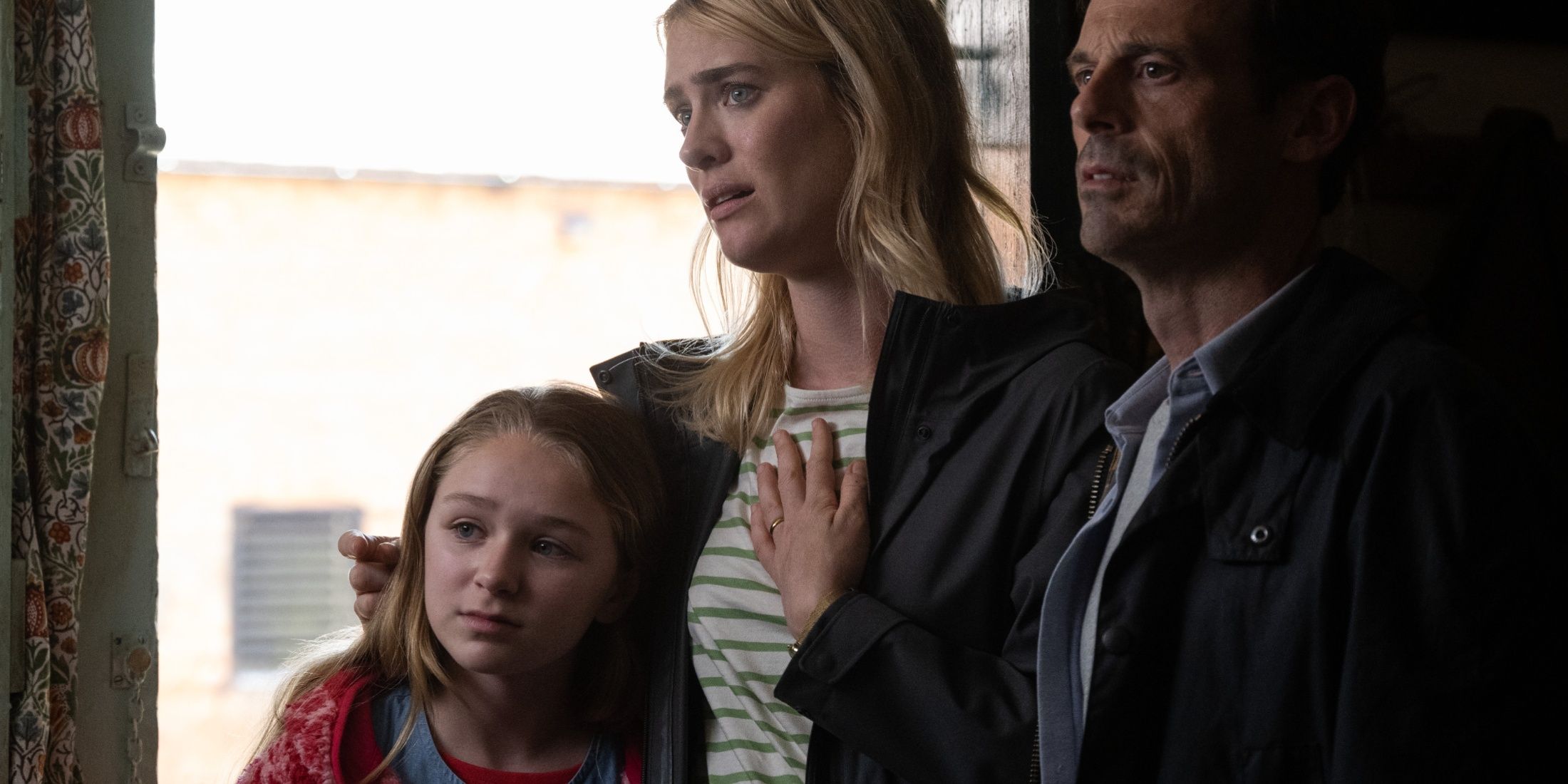 a couple with their daughter looking all anxious in the movie speak no evil