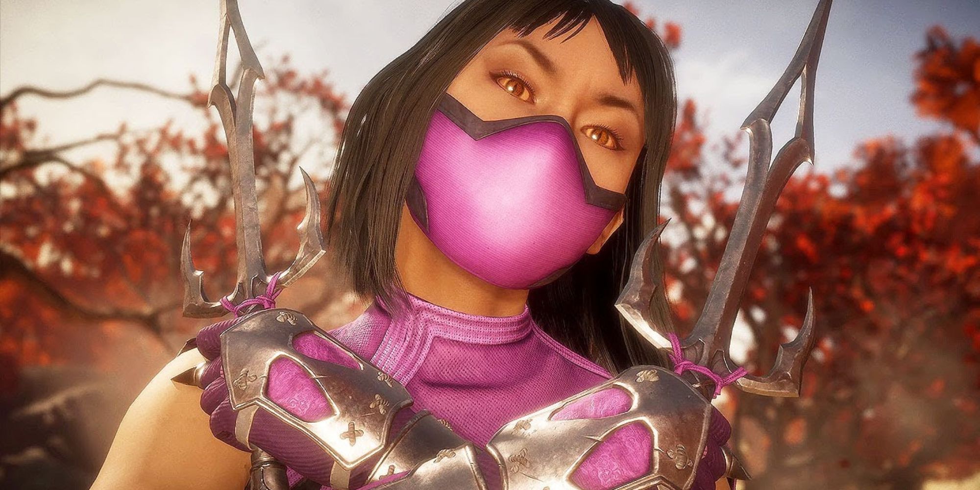 Mortal Kombat 11 Mileena posing with her sai in a forest.