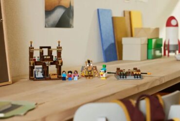 A collection of Lego Minecraft minifigures and scenery laid out on a wooden table