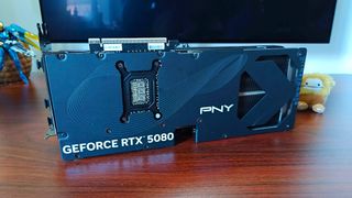 PNY RTX 5080 OC graphics card sitting on site with backplate in view