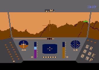 A screenshot from the Atari 8-Bit version of Rescue on Fractalus, where a pilot approaches a mountain range with a weapons installation visible.