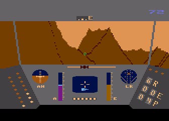 A screenshot from the Atari 8-Bit version of Rescue on Fractalus, where the player spies a pilot in need of rescue in a brown mountain range.