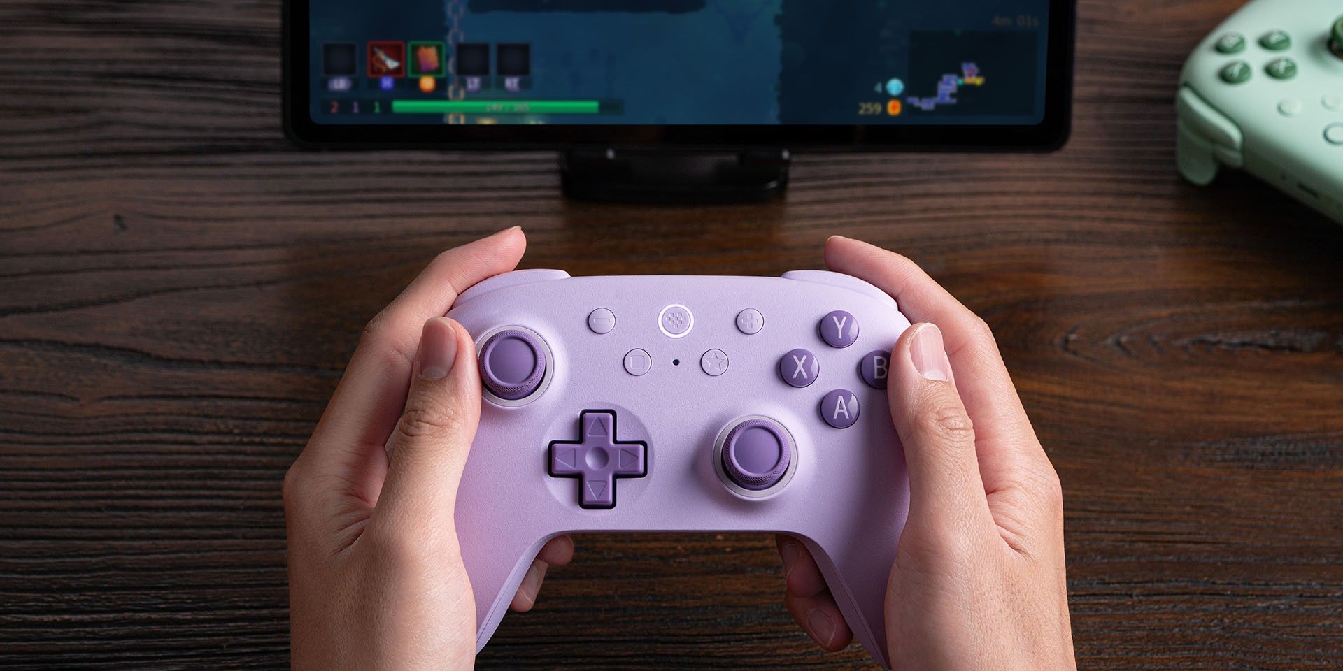 Someone gaming with the 8BitDo Ultimate 2C controller.