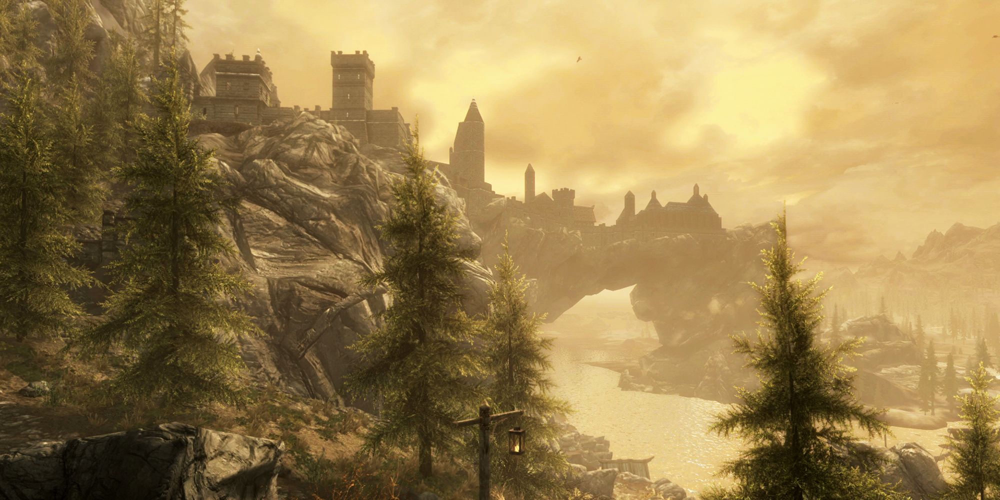 Looking at cliffs and castles in the distance of Skyrim.