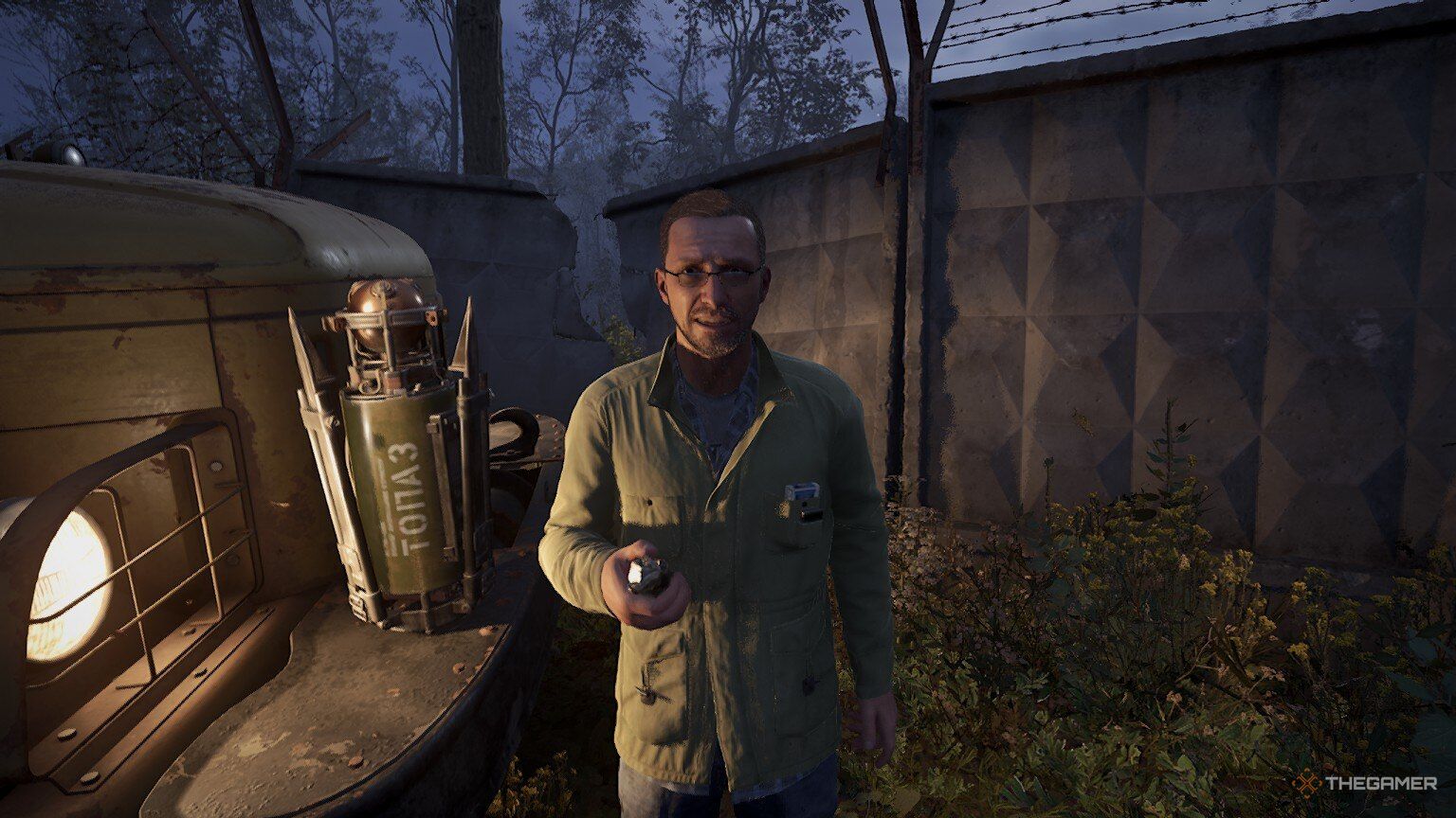 A first-person view of Hermann holding an artifact in Stalker 2: Heart Of Chornobyl.