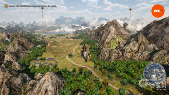 Dynasty Warriors review: a birds eye view of the landscape, with green fields flanked by large mountains.