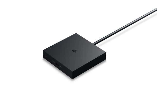 A promotional image of the PlayStation VR2 PC Adapter. The image shows a black box with one wire coming out of the end of it. The PlayStation logo can be seen on top of the box.