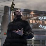 The protagonist of GTA 4 holding his hand out in front of a Diner