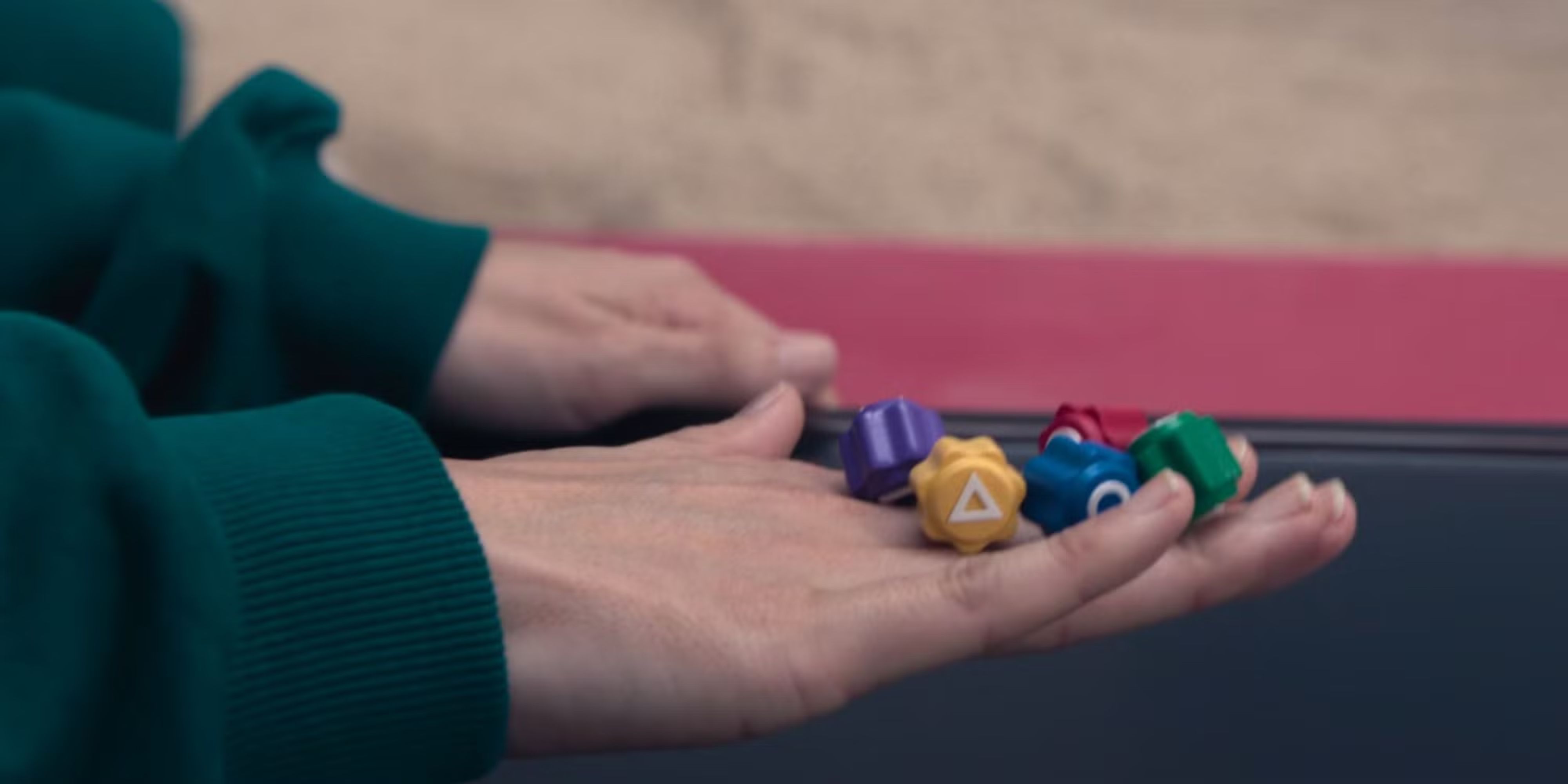 Gonggi stones on the back of a hand in Squid Game