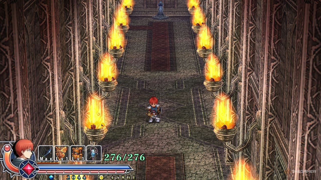 Adol in a hallway of valestein castle with a series of lit torches on the wall in ys memoire the oath in felghana.