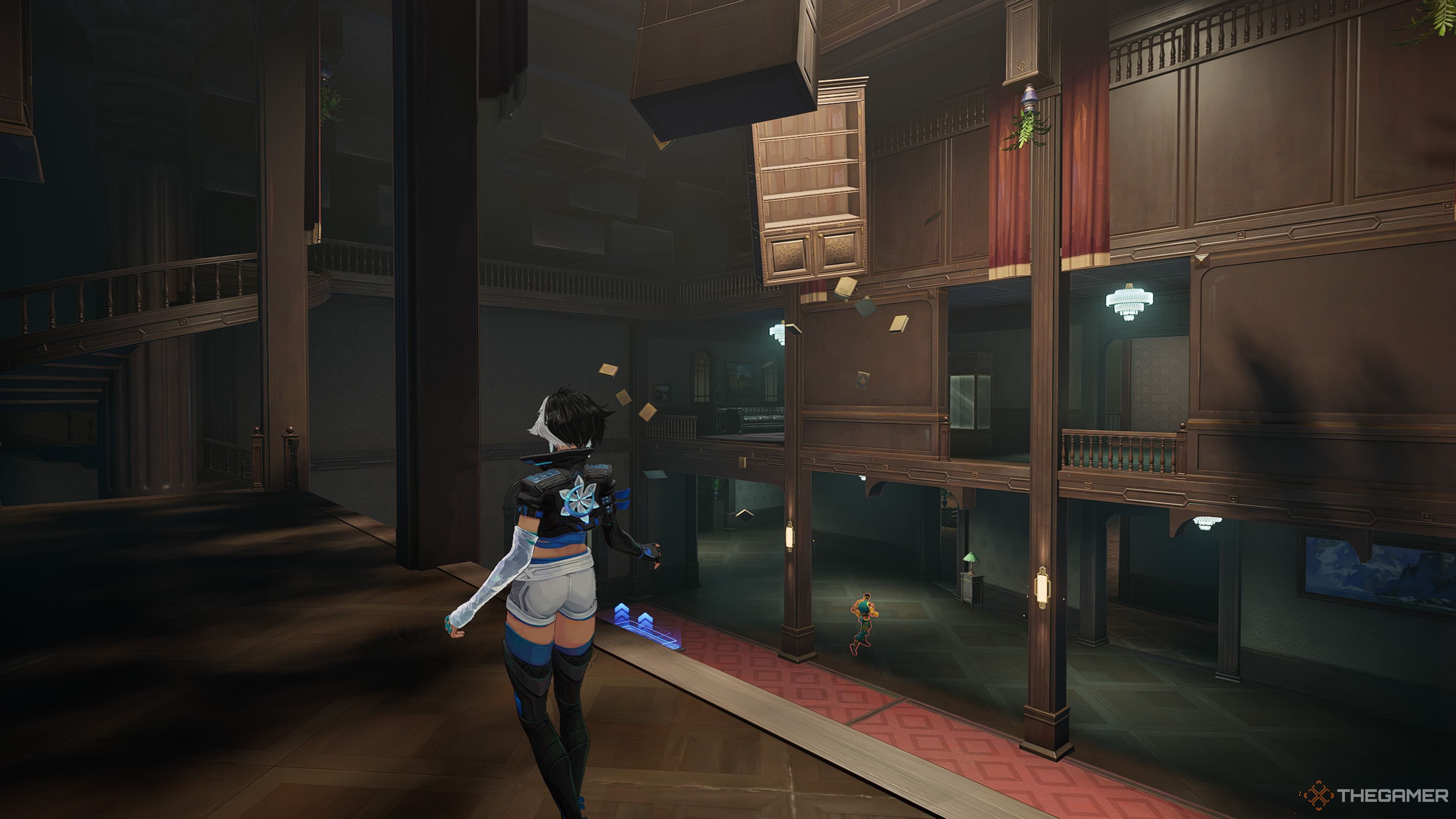 An image of Luna Snow inside the Sanctum Sanctorum with floating furniture and books visible in the background. Luna Snow is on the first floor and Iron Fist is running around on the ground floor below. 