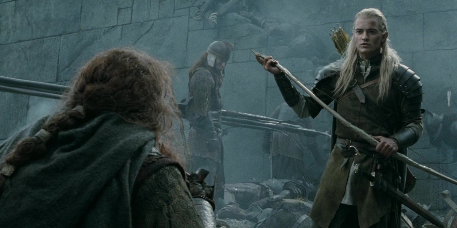 Legolas speaking to Gimli with Gimli's back turned toward camera