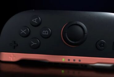 The switch 2 right joy-con on its side looking liek a computer mouse attached to some device