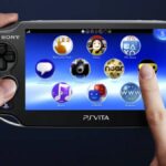 Someone holding a PS Vita.