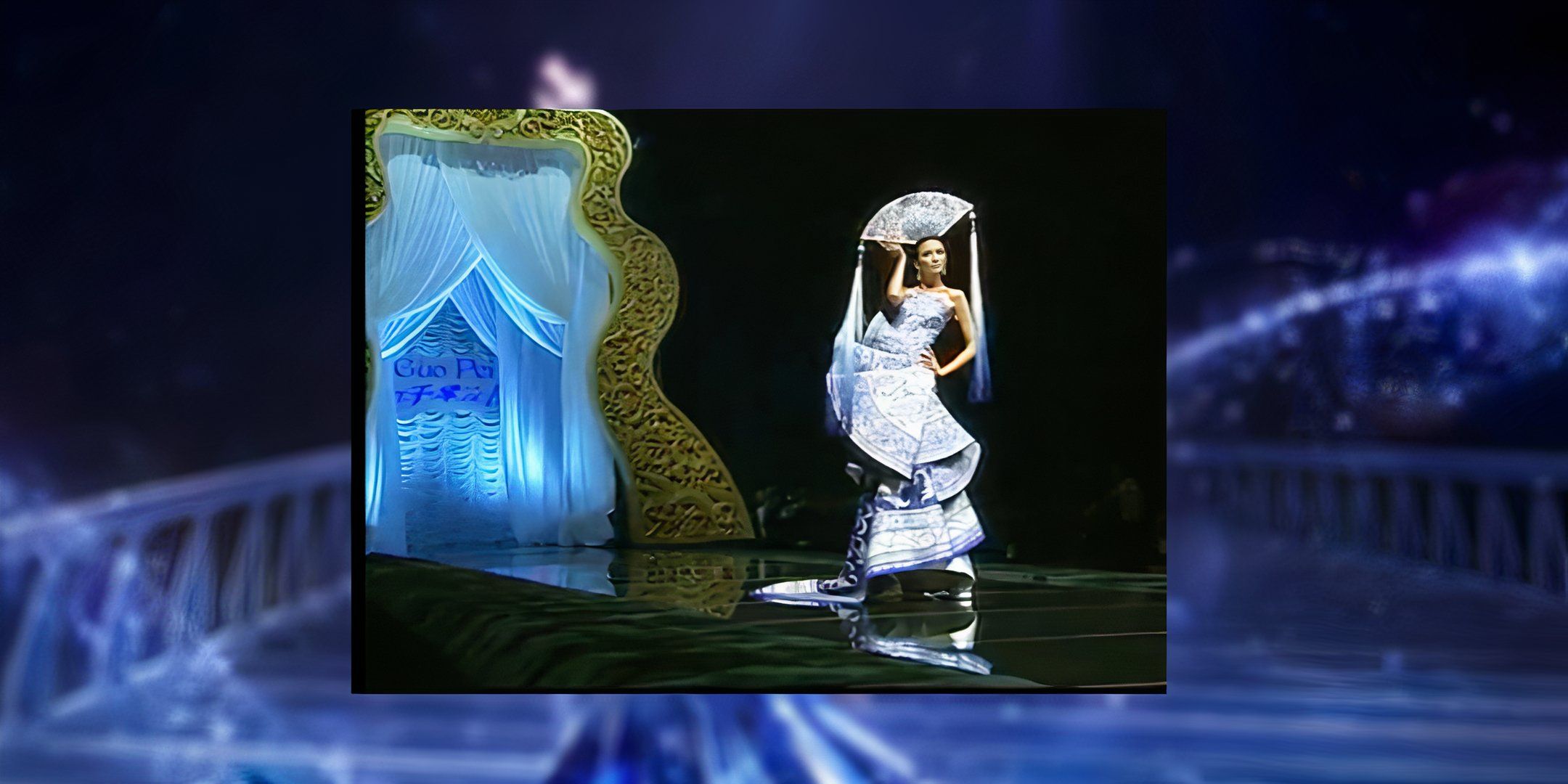 A model walks down the runway in a dress inspired by imperial chinaware.