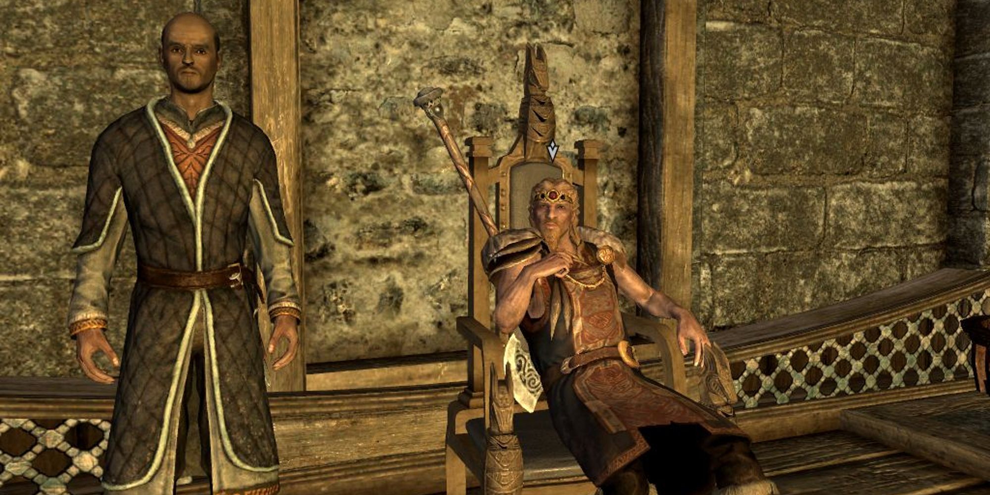 Jarl Balgruuf the Greater sitting on his throne next to an advisor within Dragonsreach