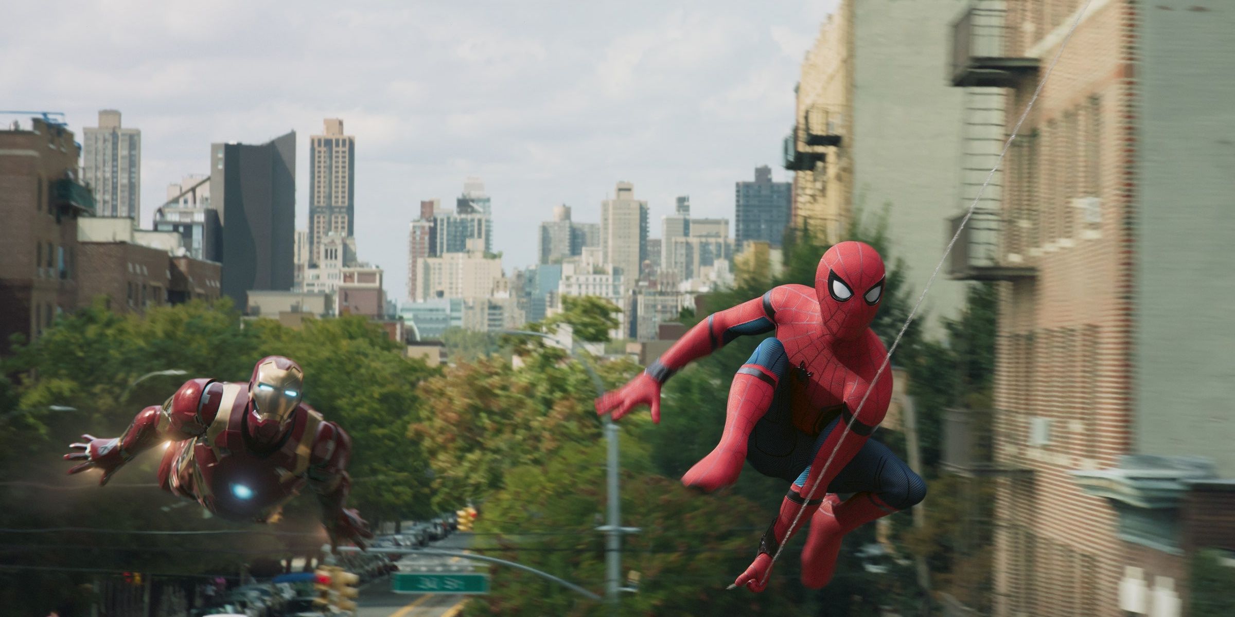 Spider-Man and Iron Man flying through New York