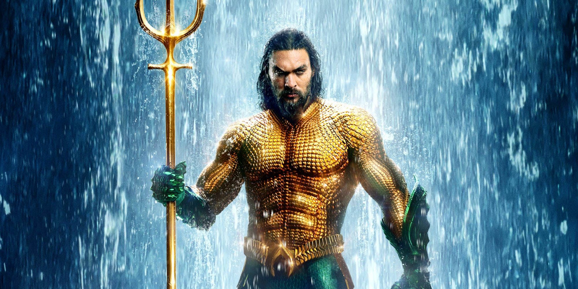 Aquaman poses in his armour and trident.