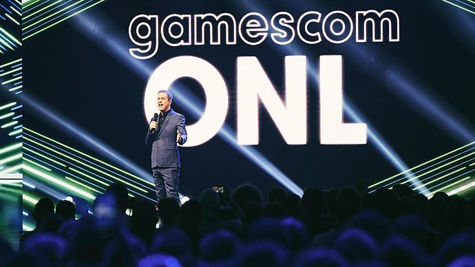 A photo of Opening Night Live founder Geoff Keighley on stage at Gamescom with the acronym ONL in large letters behind him.