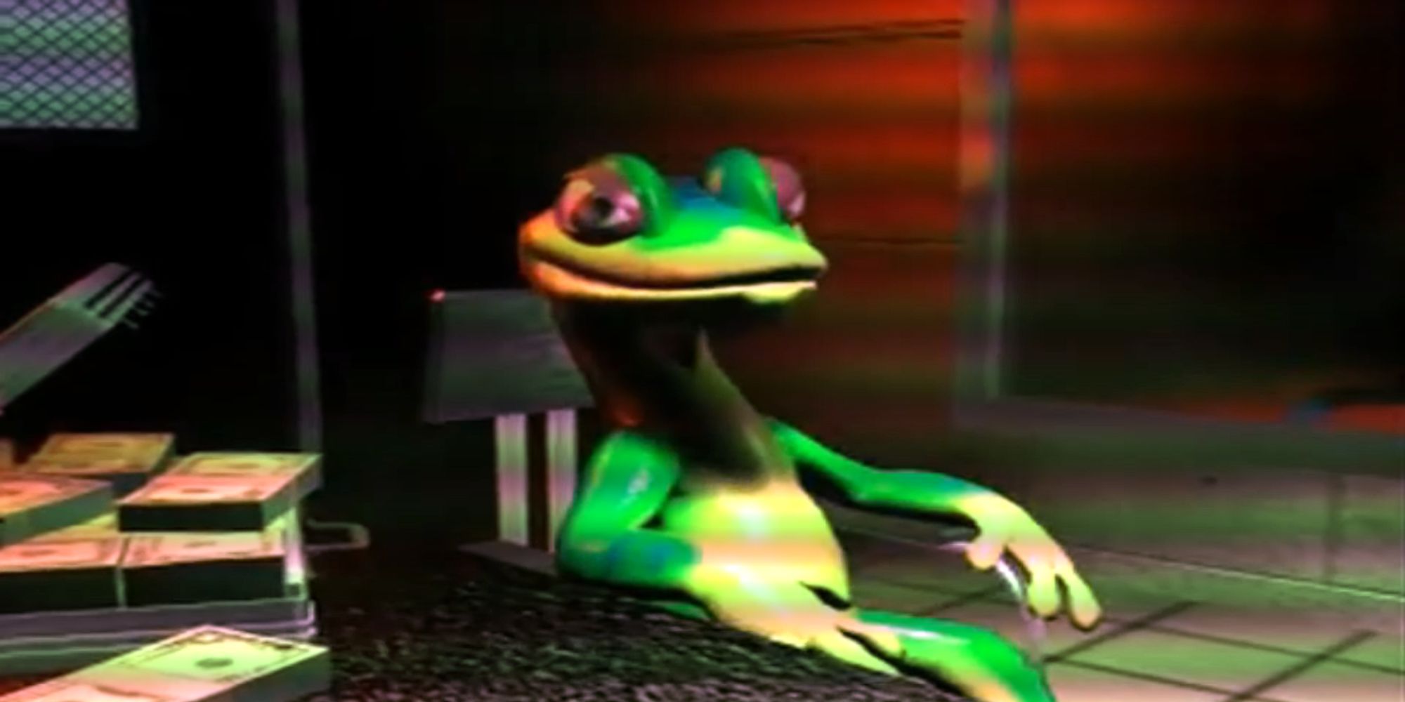 Gex sits in an interrogation room with an open suitcase full of money on the table to his right from Gex Enter the Gecko