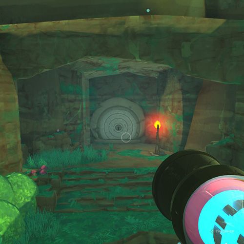 The player is standing in front of the Slime Gate that grants access to Ancient Ruins from the Moss Blanket in Slime Rancher