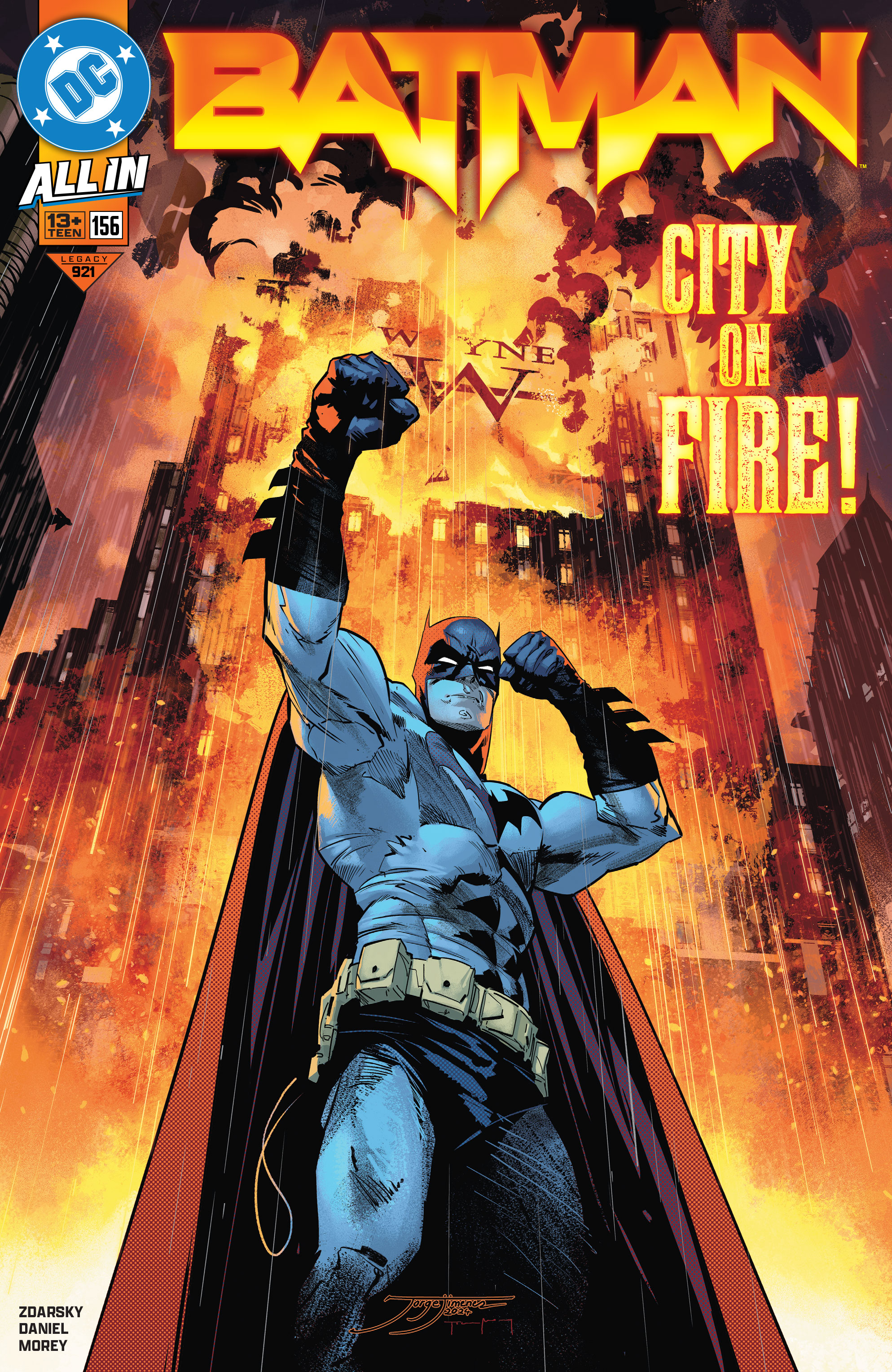 Batman stands in front of a burning Gotham City.