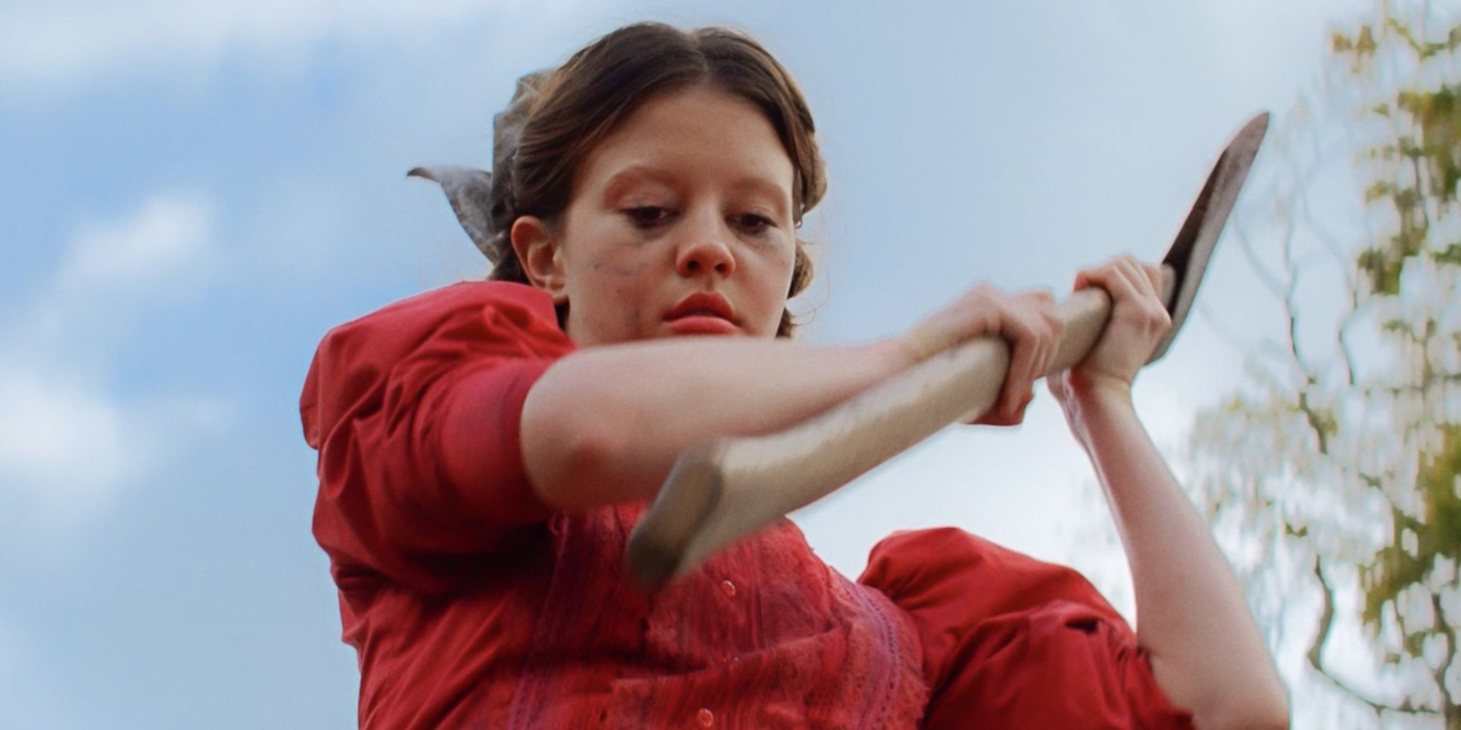 Mia Goth wielding an axe in Pearl