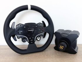 The Moza R3 racing wheel next to its wheelbase