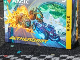 MTG Aetherdrift Bundle box on a tarmac surface, in from of a checkered start line