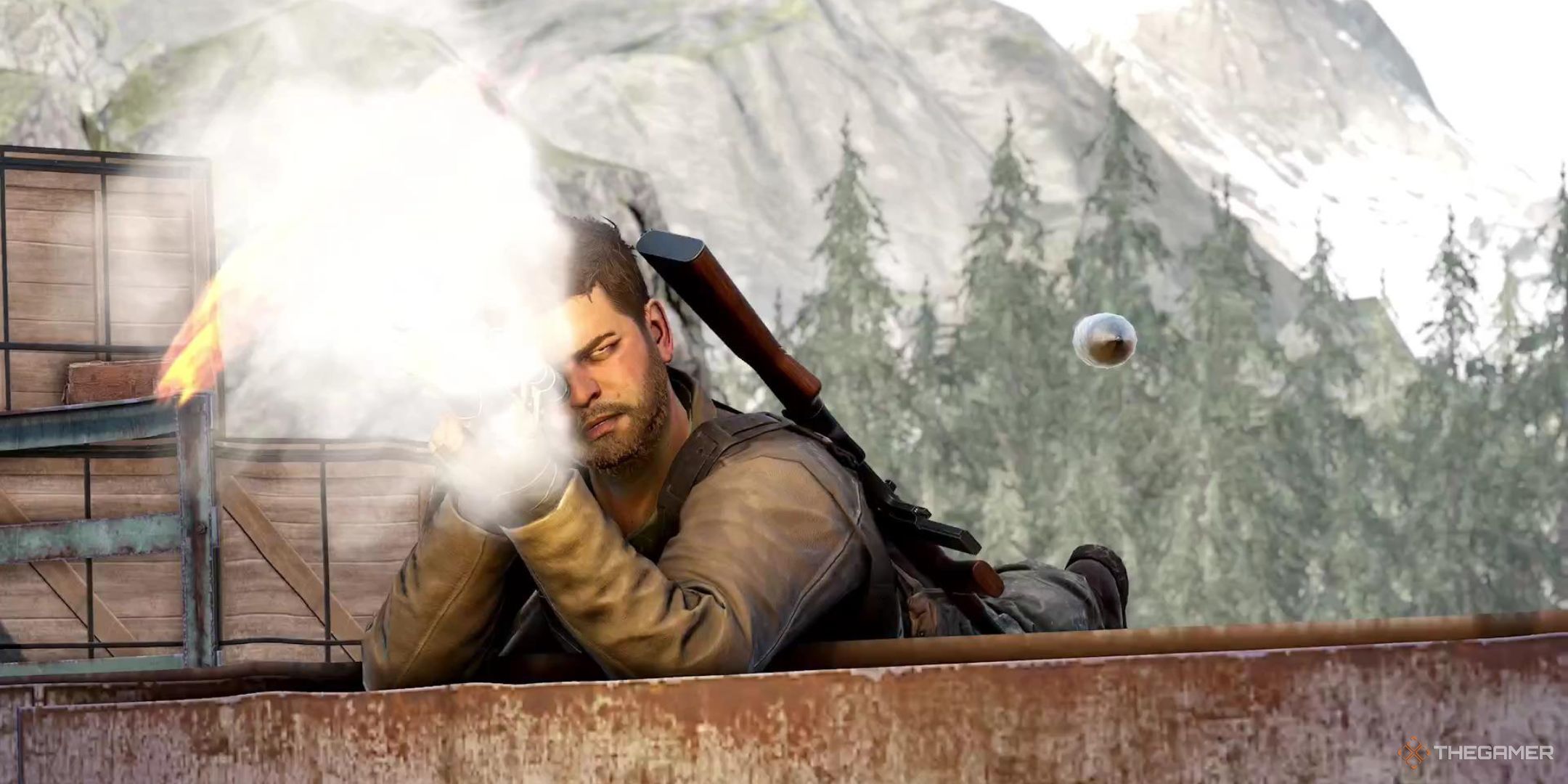 Harry Hawker lies prone firing his sniper rifle, and the bullet is traveling through the air towards in unsuspecting Nazi, in Sniper Elite: Resistance.