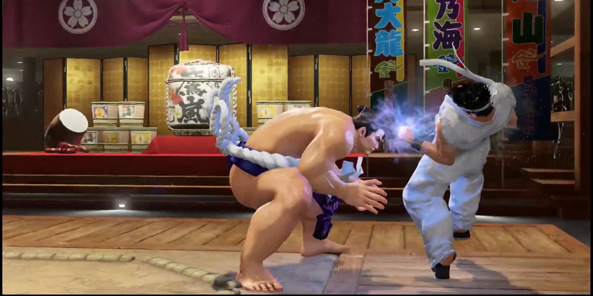 Taka pushing Akira out of the ring in Virtua Fighter 5 Revo.