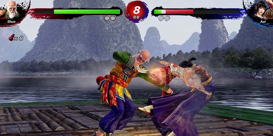 Shun Di hitting Aoi in the stomach in Virtua Fighter 5 Revo.