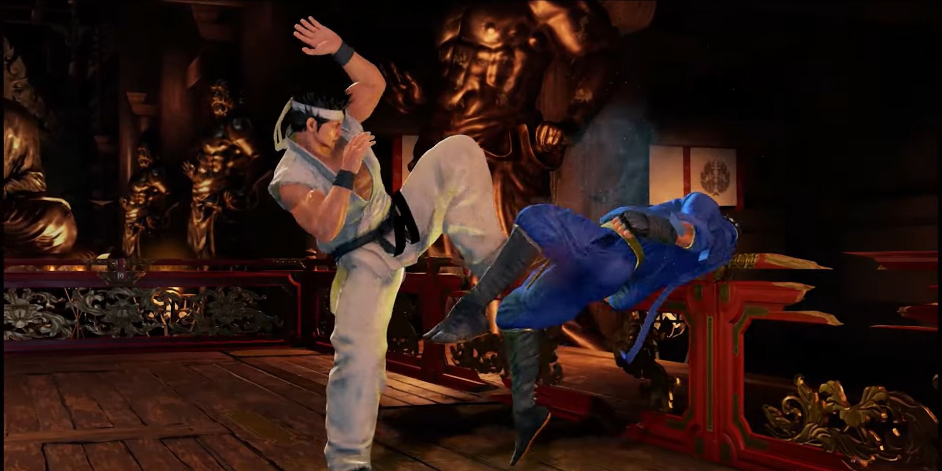 Akira chopping Kage against a wall in Virtua Fighter 5 Revo.