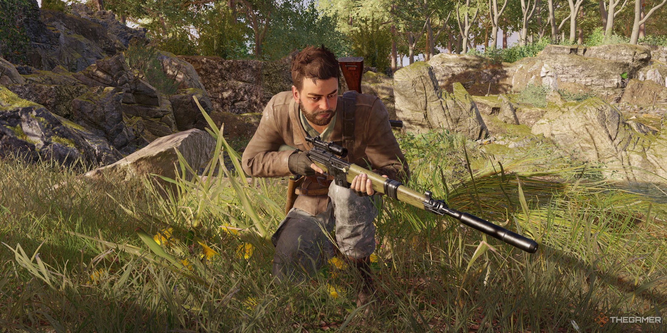 Harry Hawker kneeling in the grass in Sniper Elite Resistance.