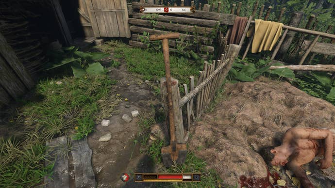 A shovel propped up against a fence in Kingdom Come Deliverance 2.