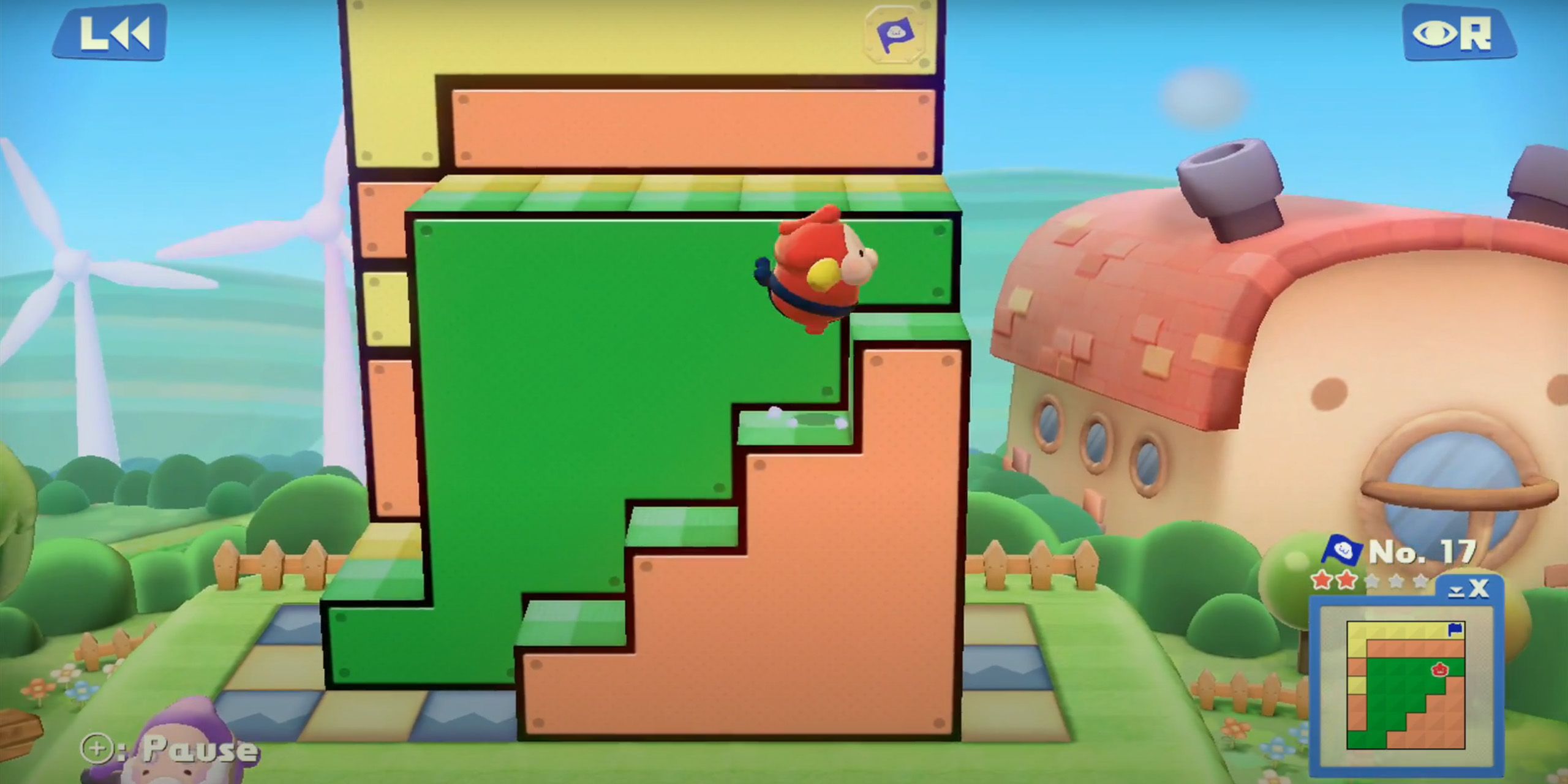 Mallo jumping up a green and orange staircase in Pushmo World.