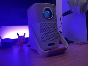 Yaber T2 projector running on a wooden desk with PS5 Pro